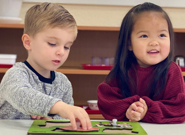Montessori School of Brentwood teacher working with two-year old toddler program